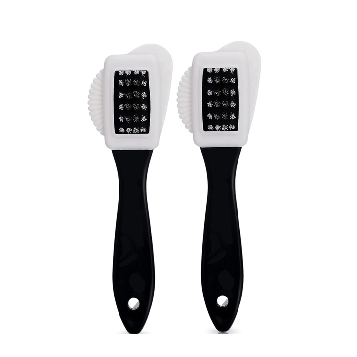 Dual sided suede and nubuck cleaning brush with black handle on white background for gentle stain removal