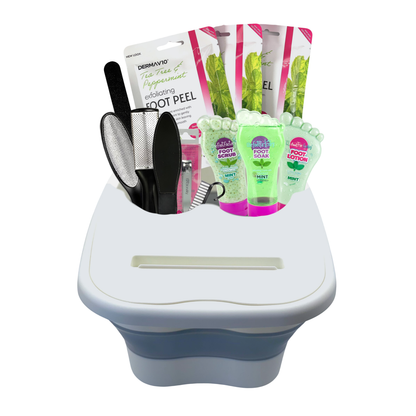 Foldable foot spa tub with removable lid holding a complete mint foot care set including foot soak, scrub, lotion, foot peel mask, and pedicure tools.