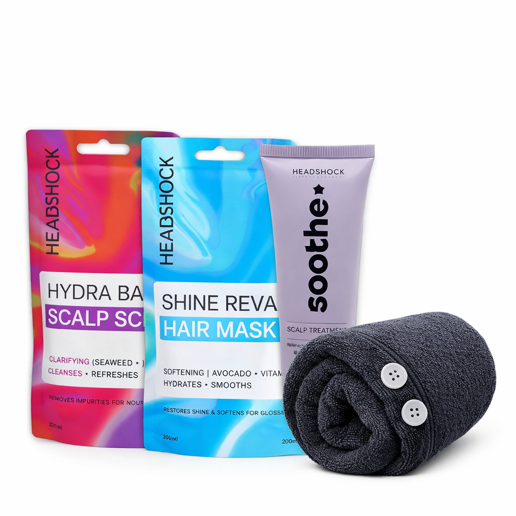 Headshock hair revival set with scalp scrub, hair mask, soothing scalp treatment and black microfiber hair wrap on white background.