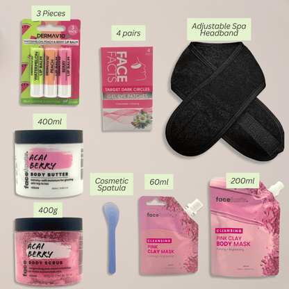 Flatlay of pink clay spa gift set contents including lip balms, gel eye patches, acai berry body scrub, body butter, pink clay masks, spatula and spa headband