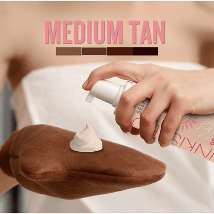 Medium self tan mousse applied onto tanning mitt showing creamy texture for even streak free tanning