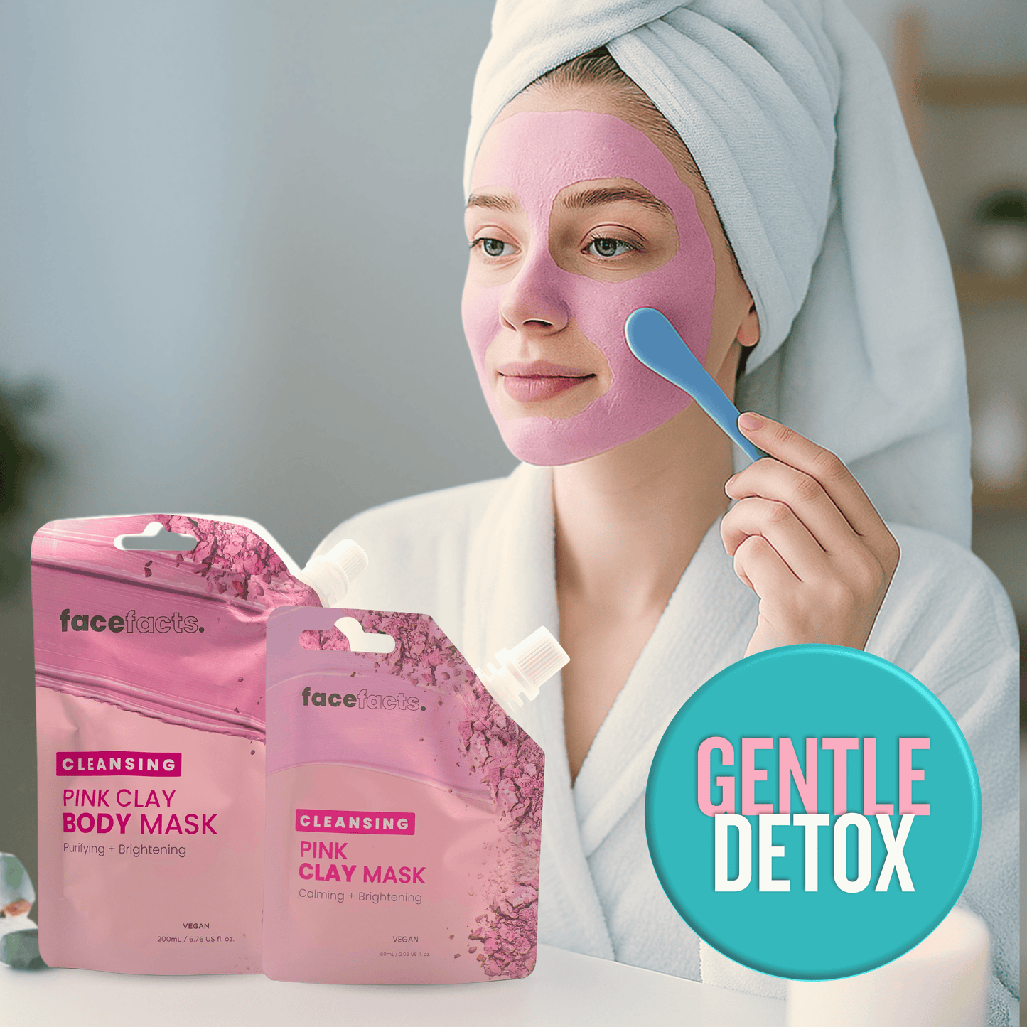 Pink clay body and face mask being applied with spatula showing gentle detox and brightening skincare treatment
