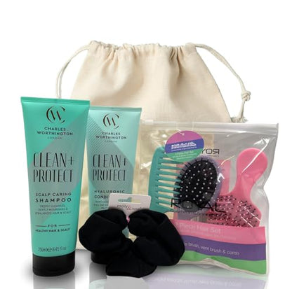 Hair care gift set featuring shampoo, conditioner, brushes and scrunchie packed in a reusable drawstring bag