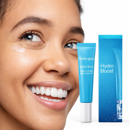 Model smiling while applying Neutrogena Hydro Boost eye cream under the eye area