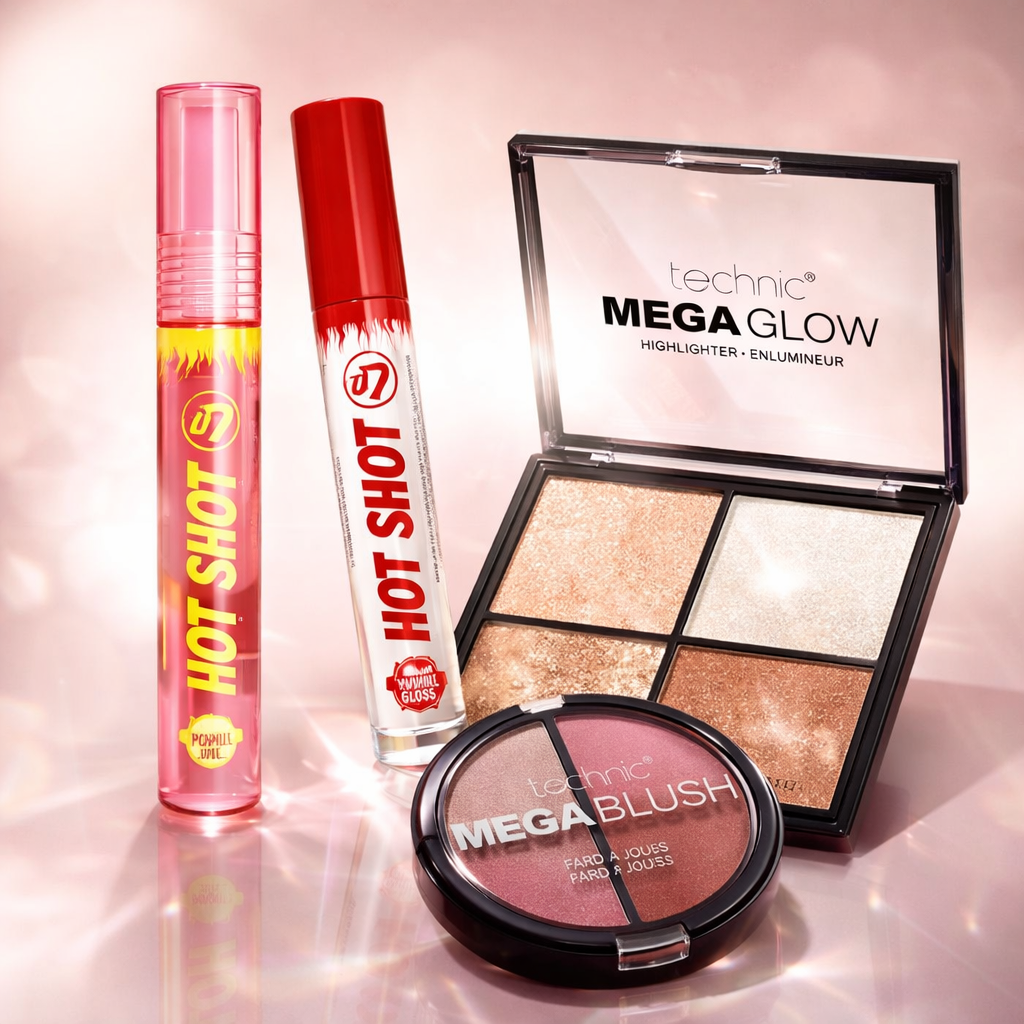 Makeup gift set including lip oil, lip gloss, blush and highlighter styled in a soft pink editorial scene