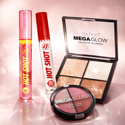 Makeup gift set including lip oil, lip gloss, blush and highlighter styled in a soft pink editorial scene