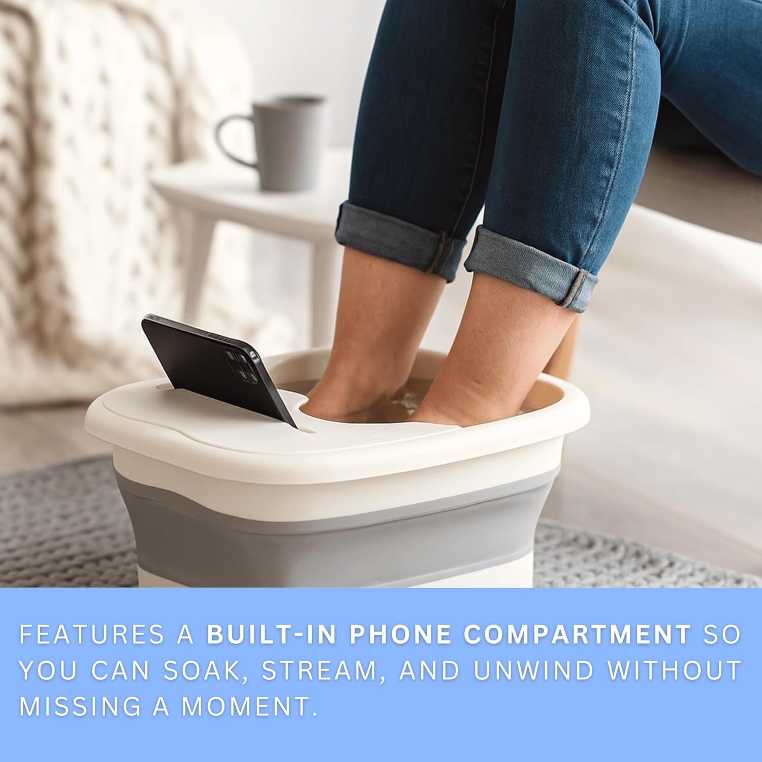 Foot spa basin with built-in phone holder allowing hands-free soaking and streaming.