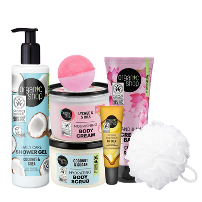 Pamper gift set featuring Organic Shop coconut shower gel, hydrating body scrub, nourishing body cream, hand cream, lip balm and bath sponge.