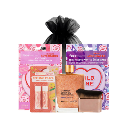 Peach glow self care gift set featuring printed sheet masks, peach lip balm, shimmer glow oil and kabuki brush on white background