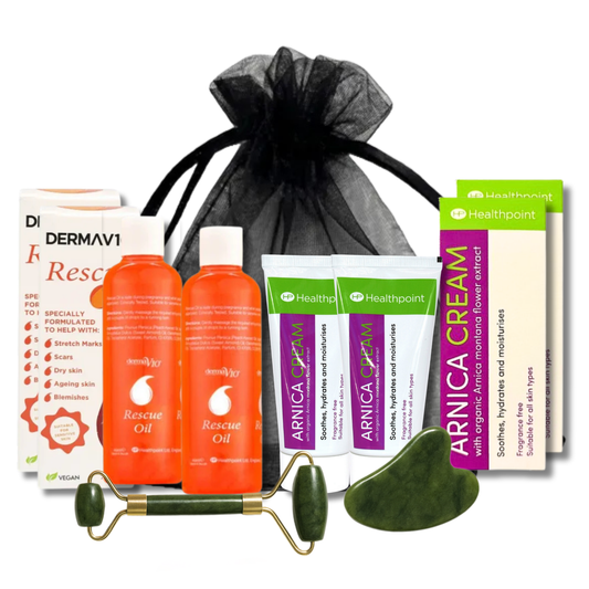 Full bundle with rescue oil, arnica cream, jade roller, gua sha, and gift bag — perfect for scar, bruise, and stretch mark care.