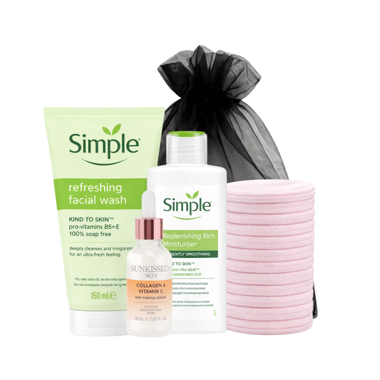Simple skincare gift set with refreshing facial wash, replenishing moisturiser, collagen and vitamin C serum, and reusable pink face towels on white background