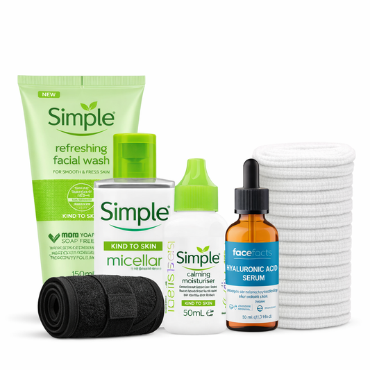 Skincare gift set with Simple facial wash, micellar water, calming moisturiser, hyaluronic acid serum, reusable cotton pads and headband on white background