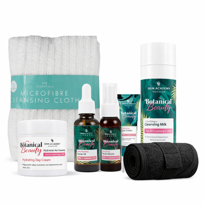 Botanical Beauty skincare gift set with cleansing milk, hydrating day cream, facial oils, microfiber cleansing cloth and spa headband on white background.