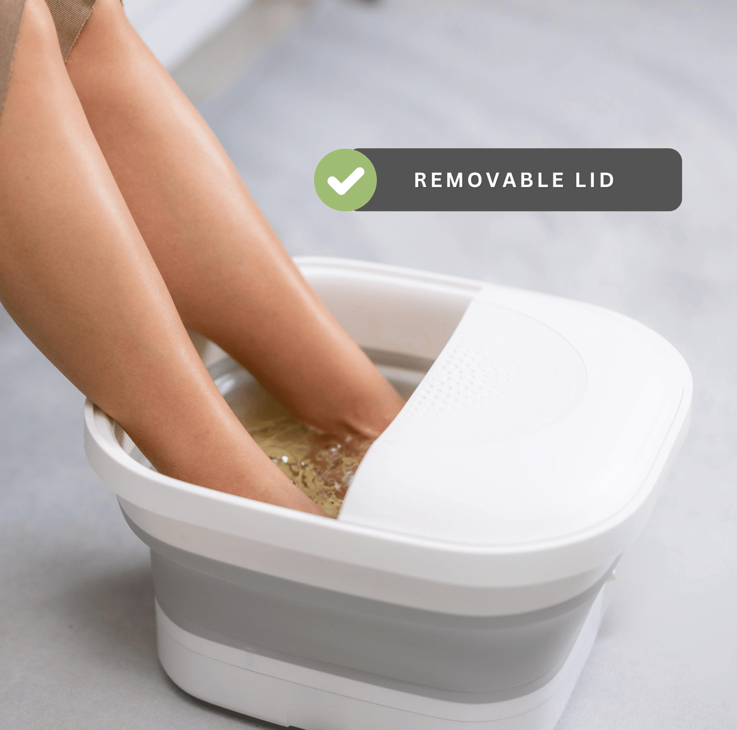 Collapsible foot spa bath with removable lid while soaking feet at home