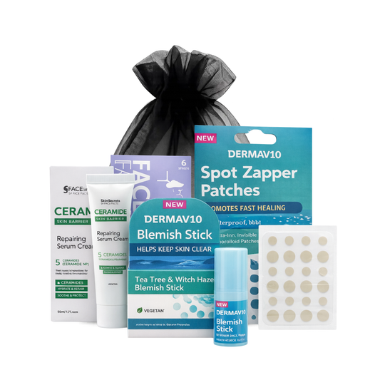 Spot care skincare kit with ceramide repairing serum cream, tea tree blemish stick, charcoal nose pore strips and DermaV10 spot zapper patches on white background.