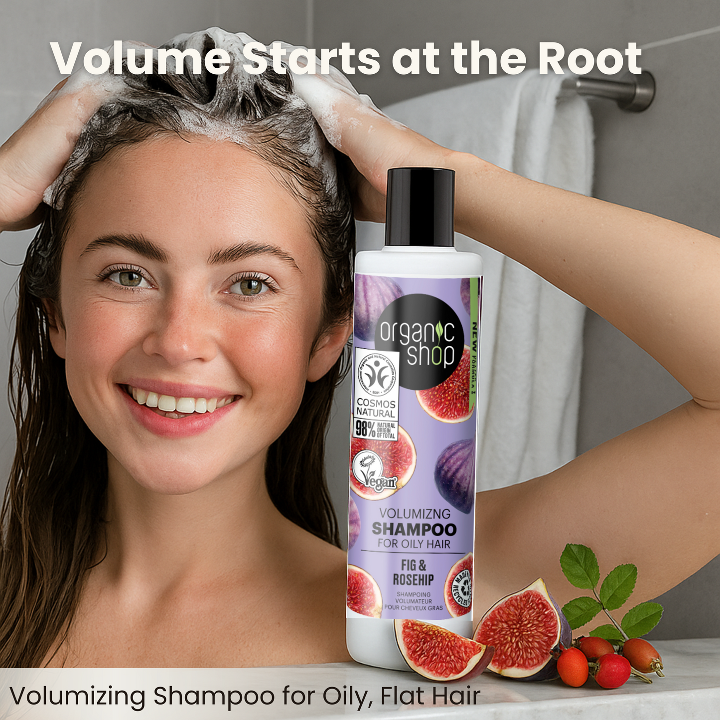 Woman shampooing hair with fig & rosehip volumizing shampoo, smiling in a bathroom setting with figs beside product.